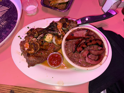 Grilled steak and shrimp with red beans and sausage