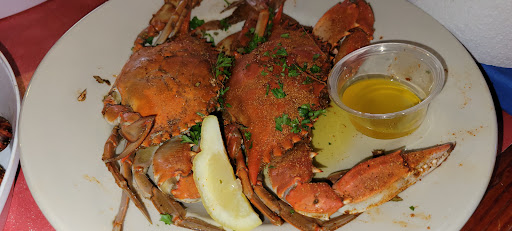 Seasoned crab boil plate with drawn butter